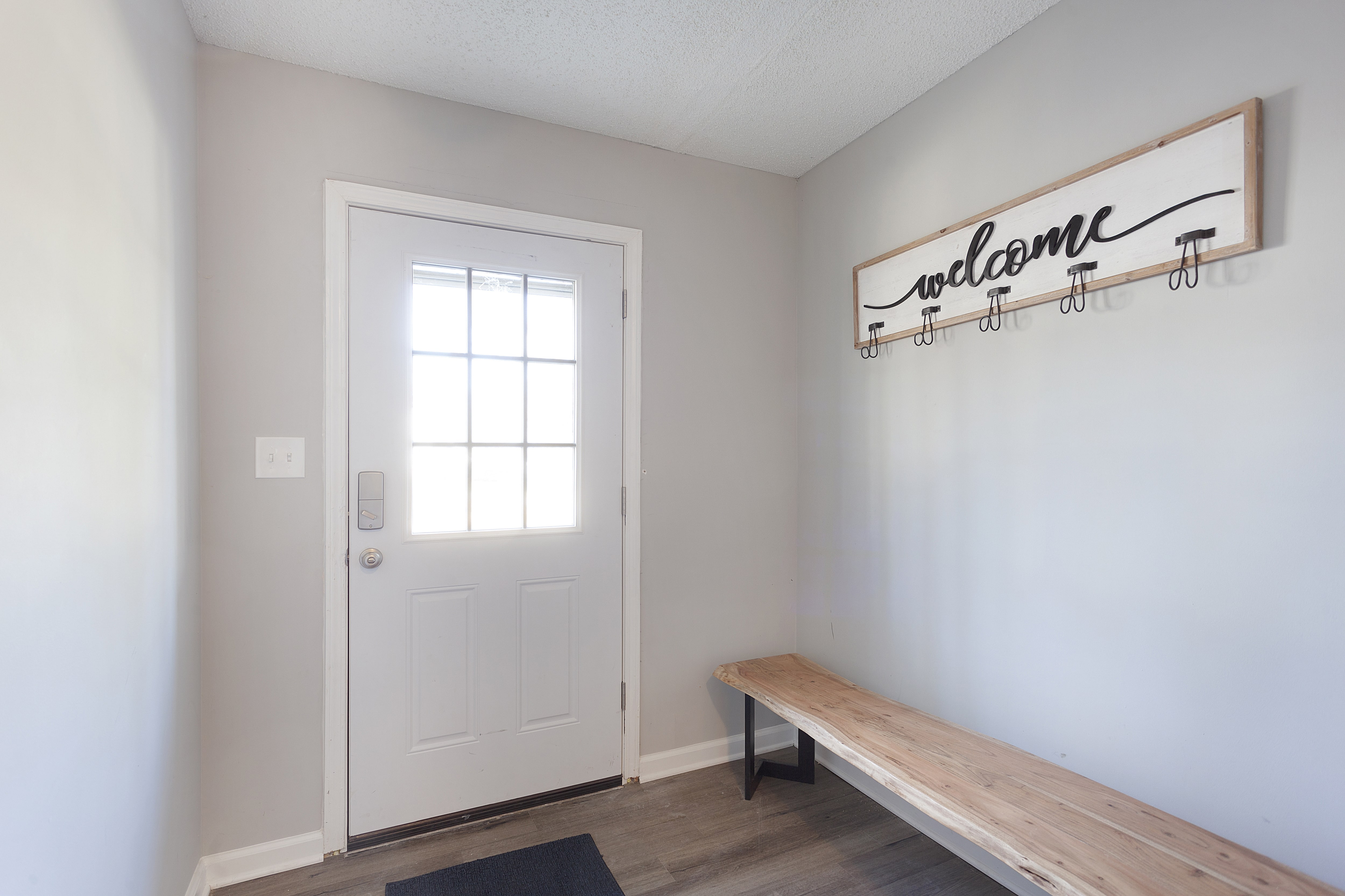 A simple mudroom with a wooden bench