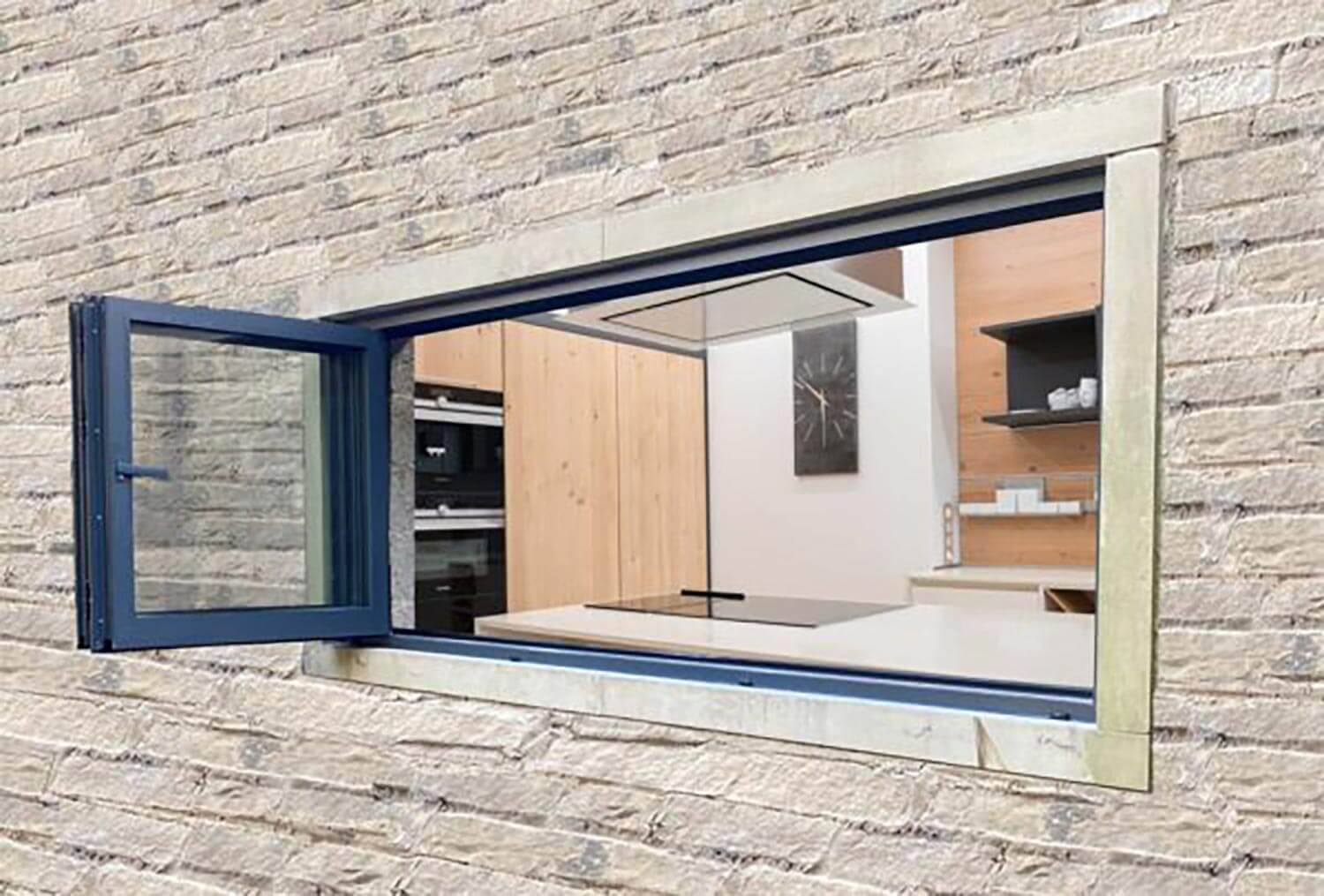 A bifold window connecting the kitchen with outdoor
