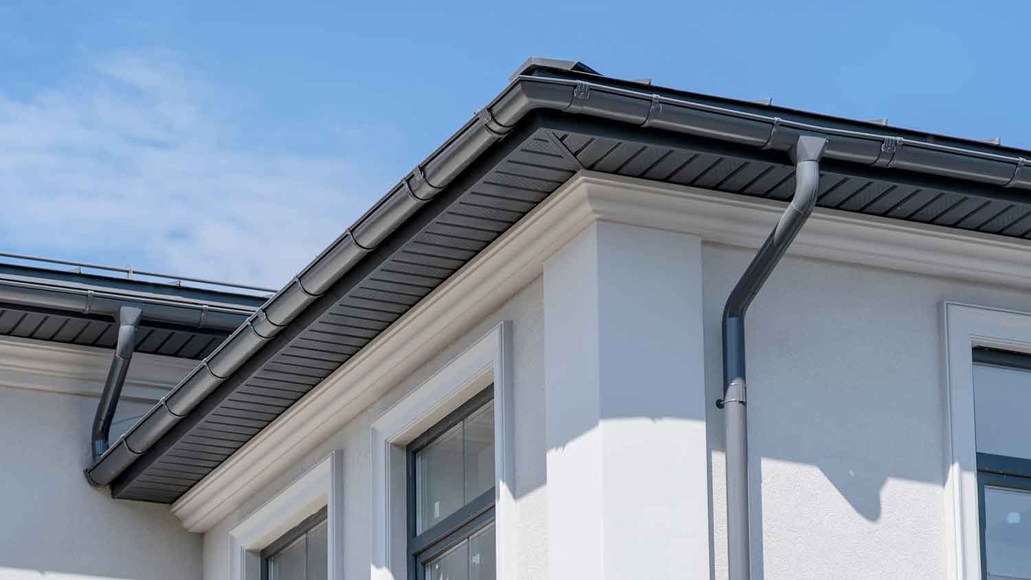 Detail of a black aluminum soffit installed on the house