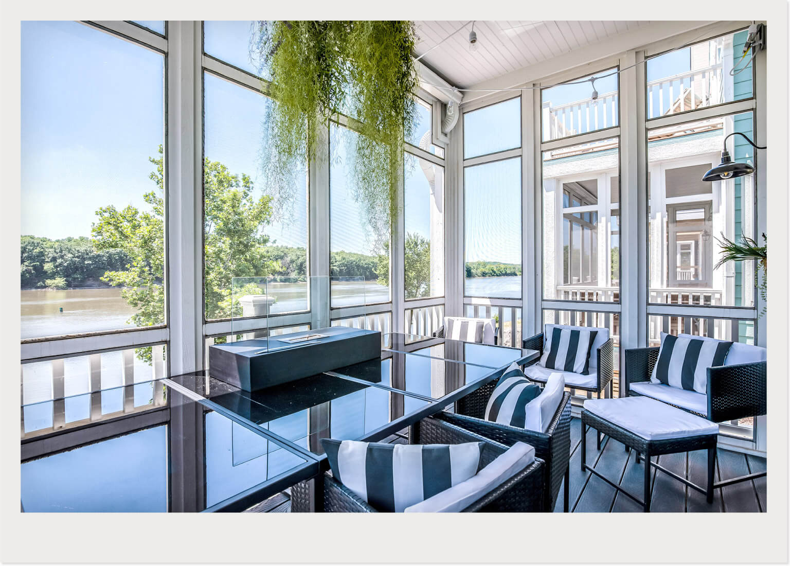 sunroom with black and white furniture 