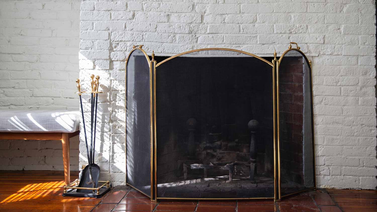 A black fireplace screen