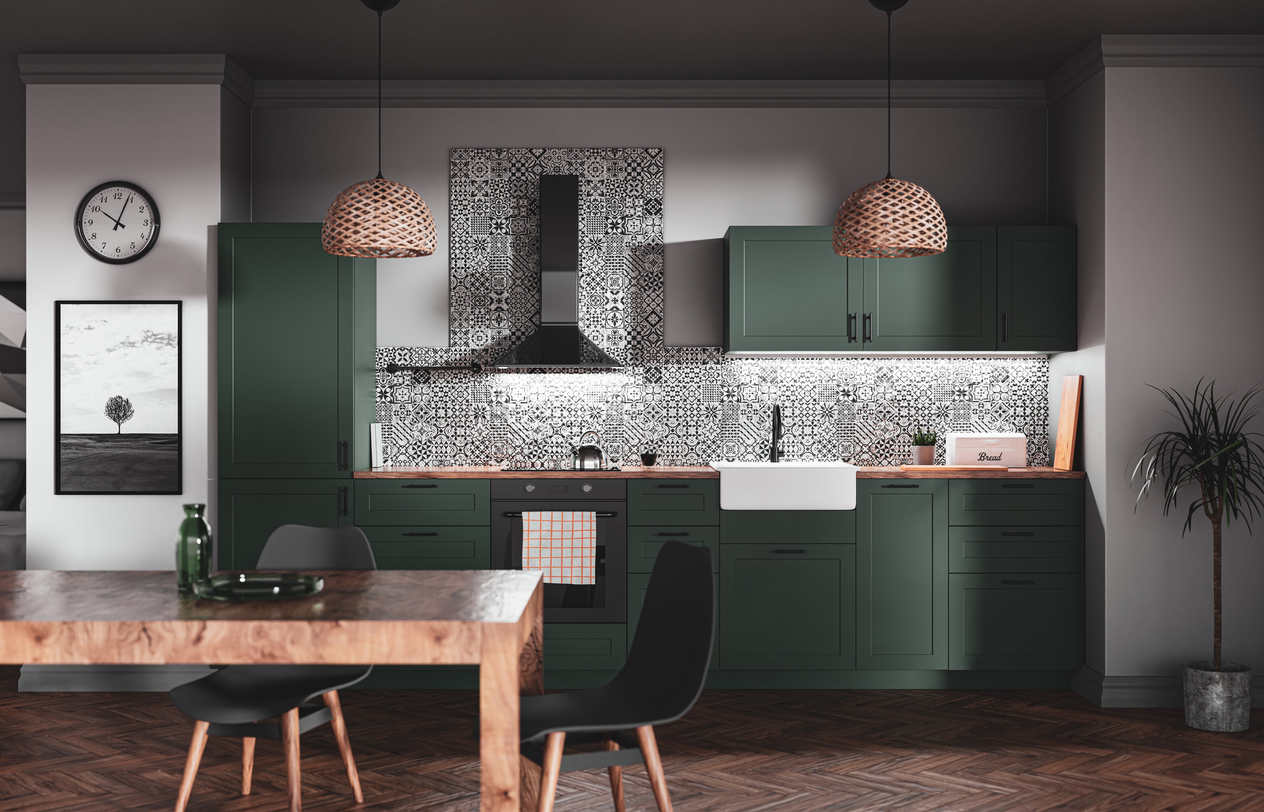 Green kitchen with black and white tiled accent wall