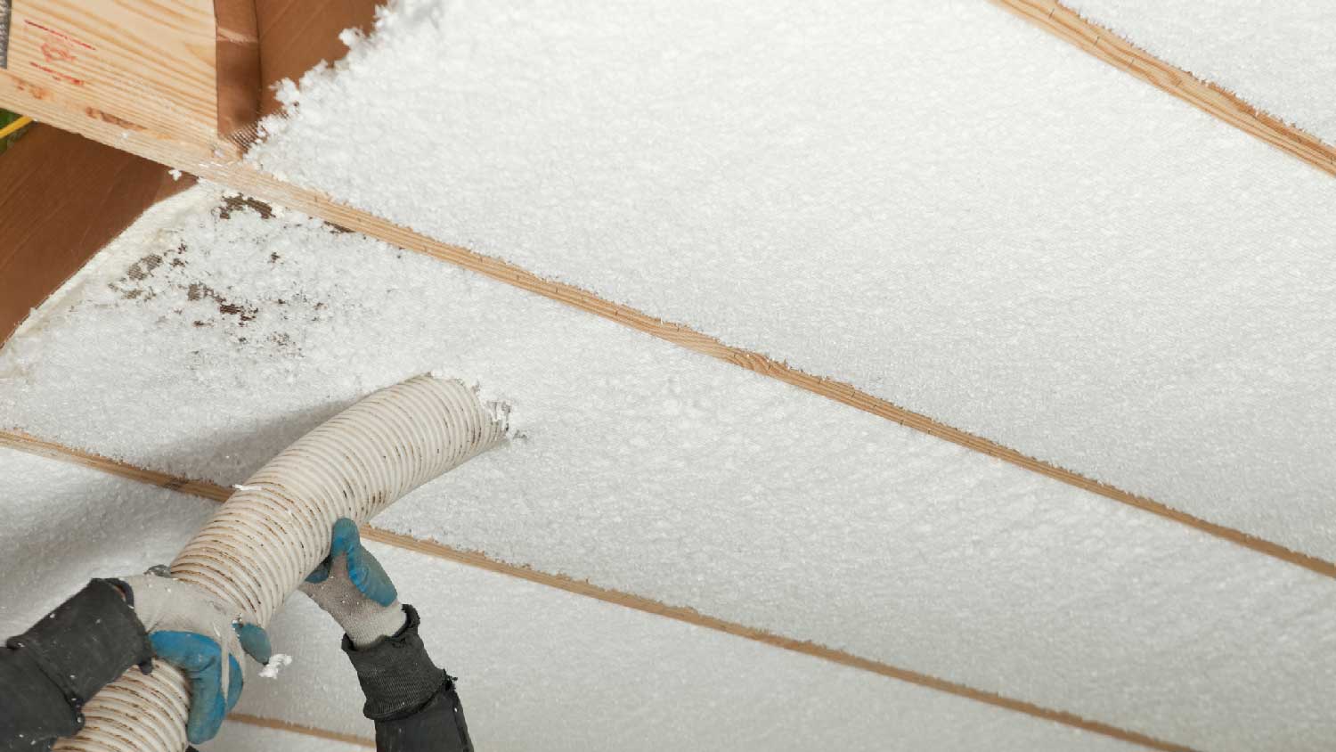 A blown-in fiberglass insulation
