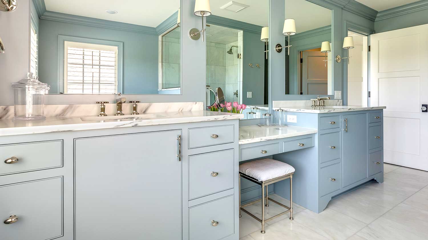 Blue bathroom vanity and double sink installed in the bathroom