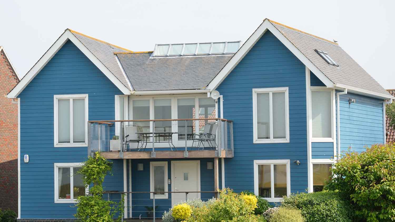 Large blue coastal home exterior