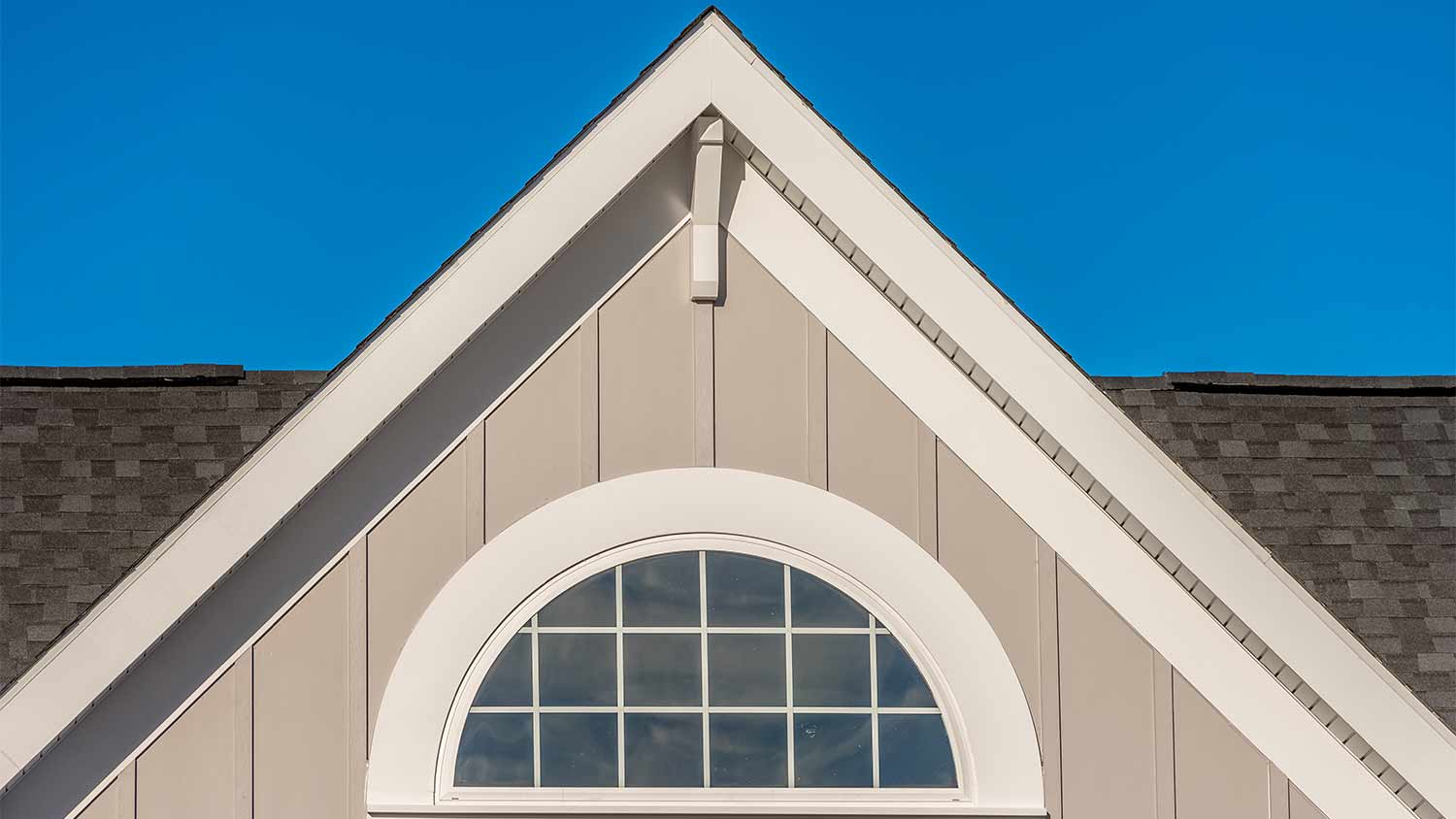 beige board and batten cement siding