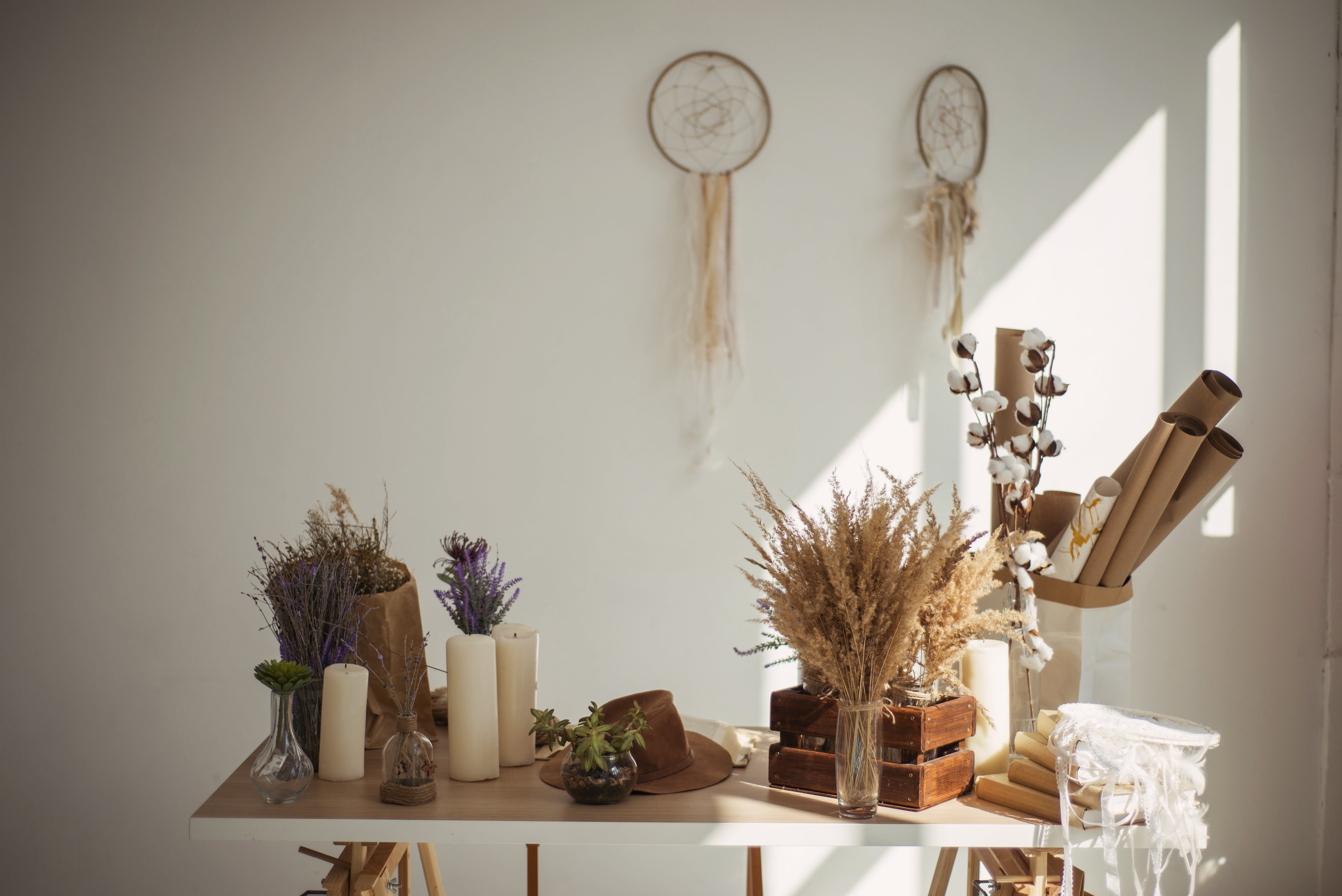 Dried flowers in vases on table