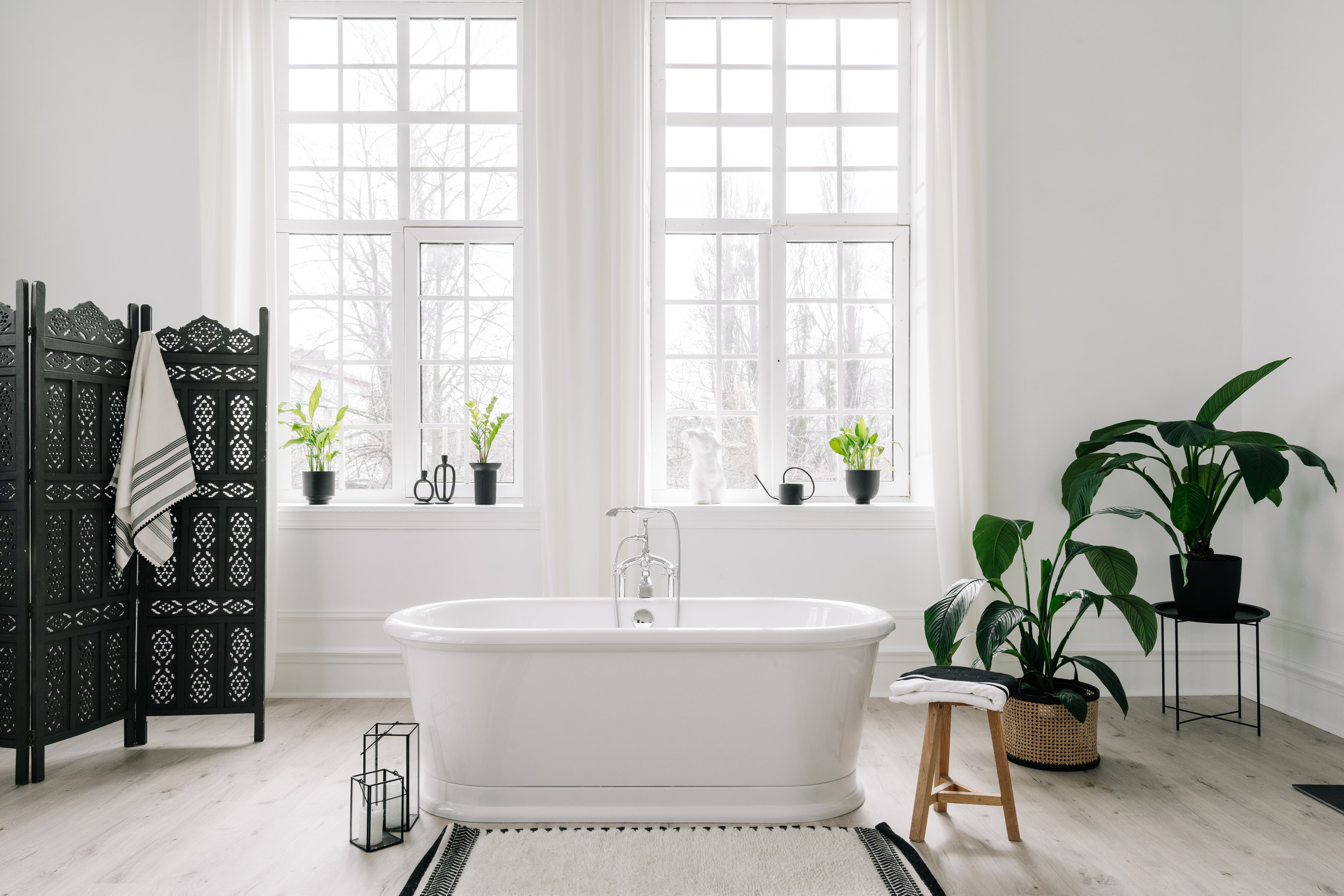 White bathroom with black textured room divider