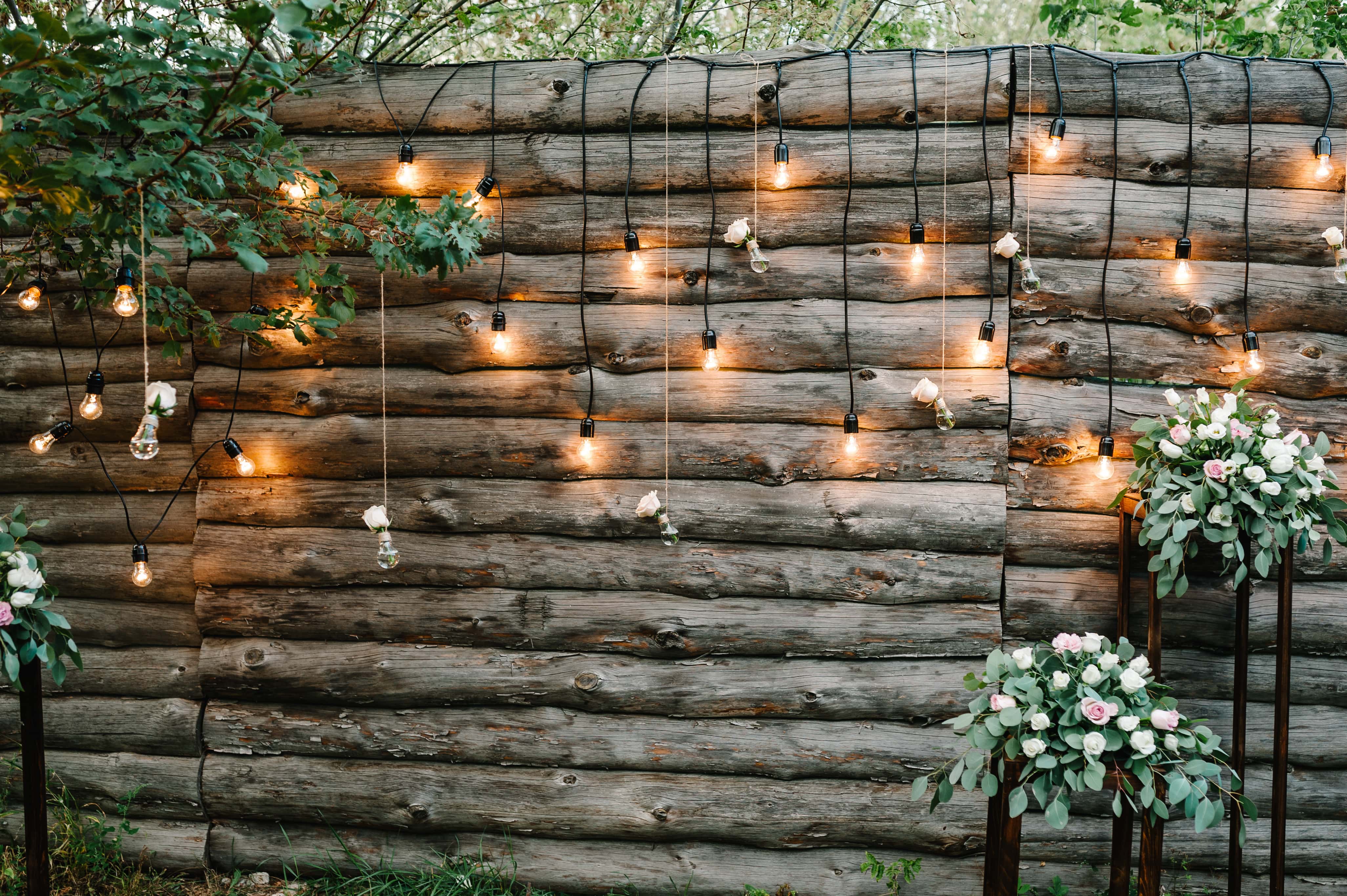 String lights hung from wooden fence