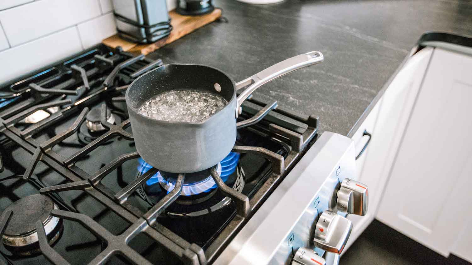 Saucepan with boiling water on the stove