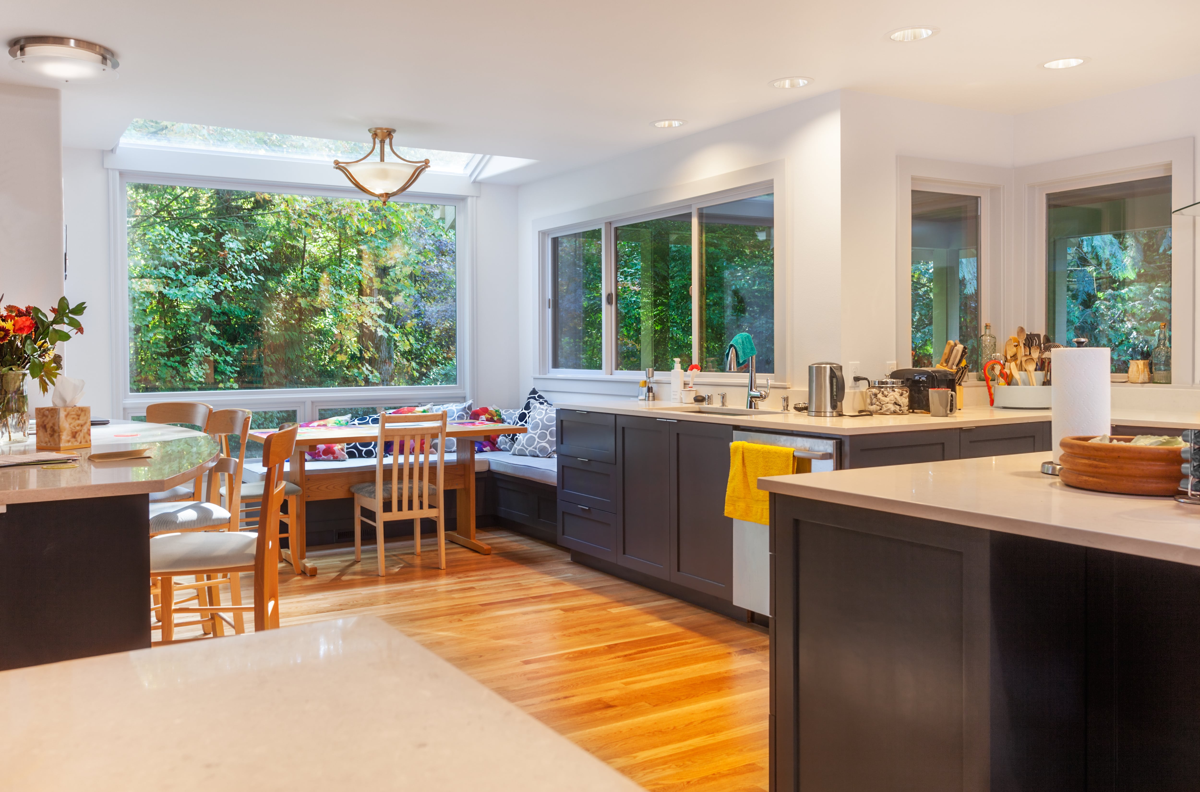 A breakfast nook with a skylight in a remodeled kitchen