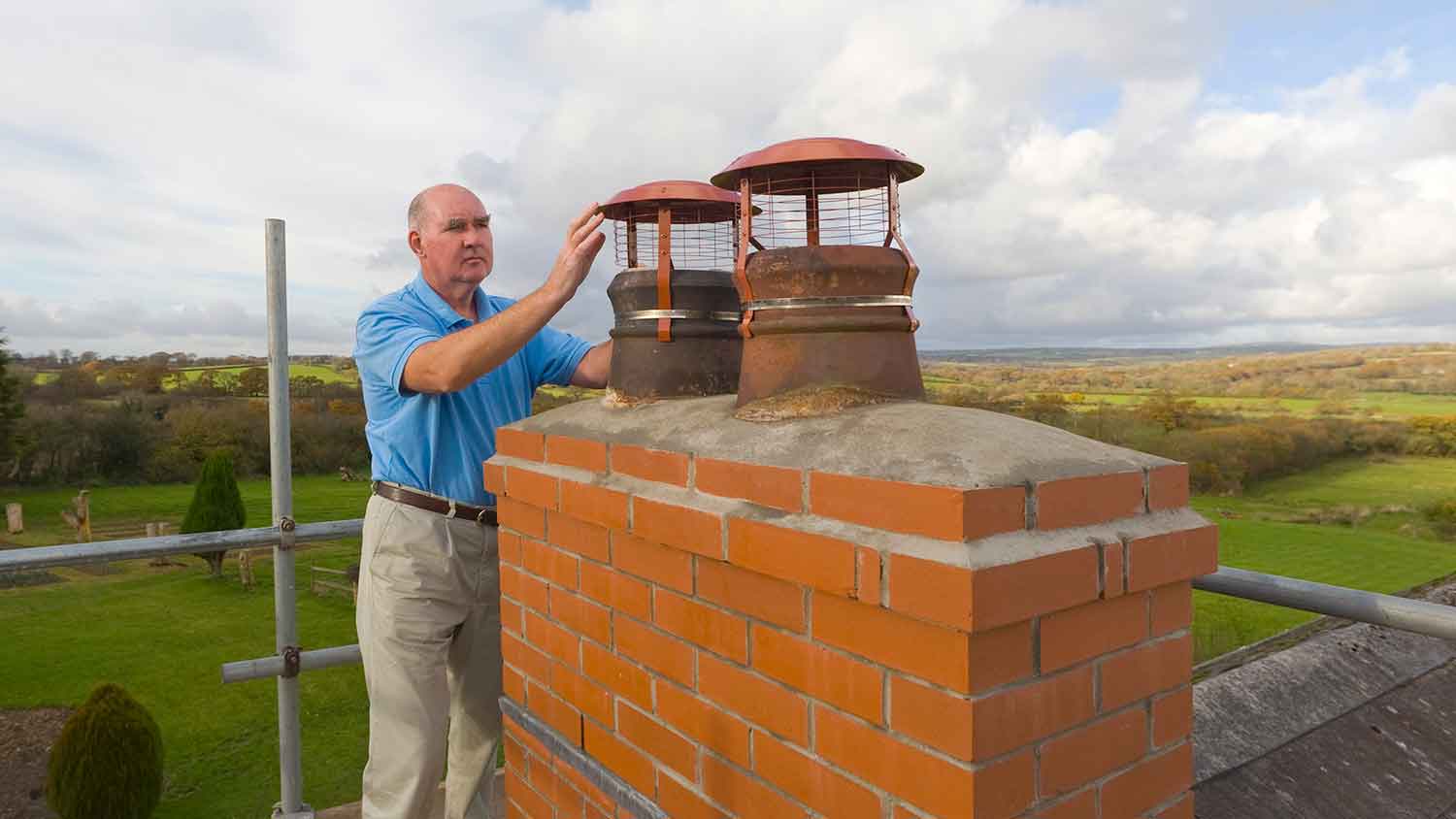 Inspector evaluating chimney exterior