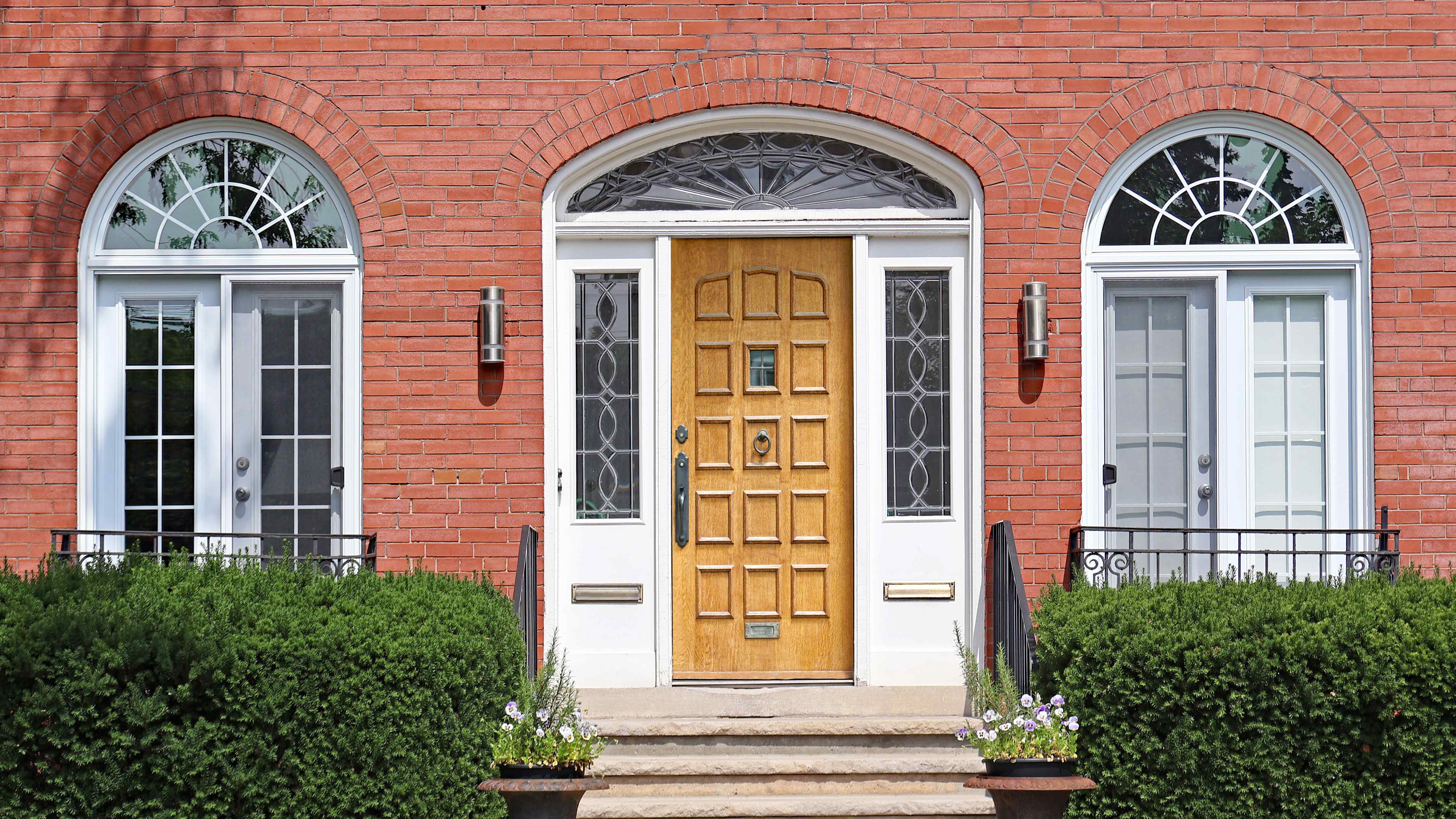 Transom windows installed on a brick facade 