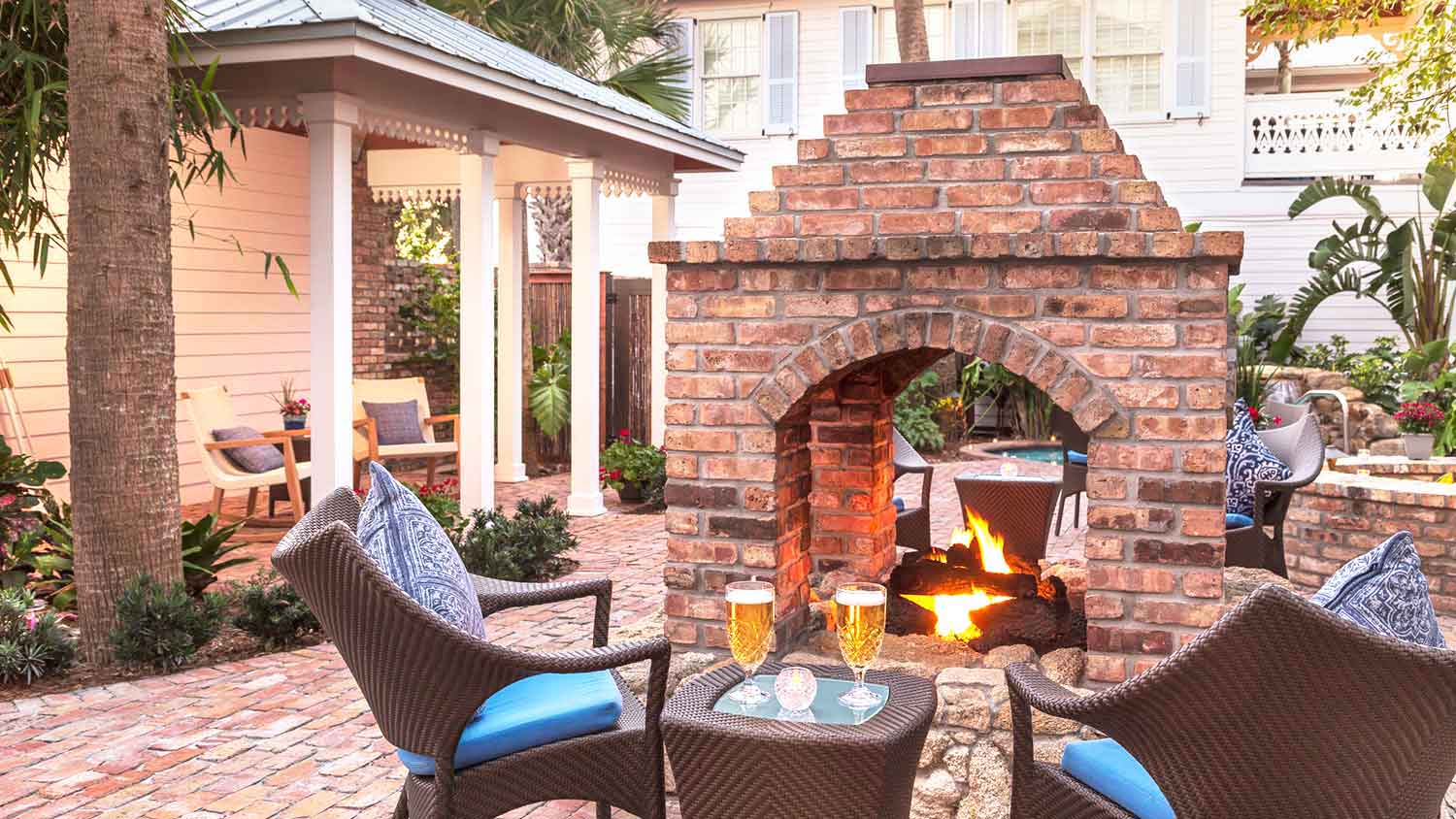 Brick patio with fireplace and outdoor furniture