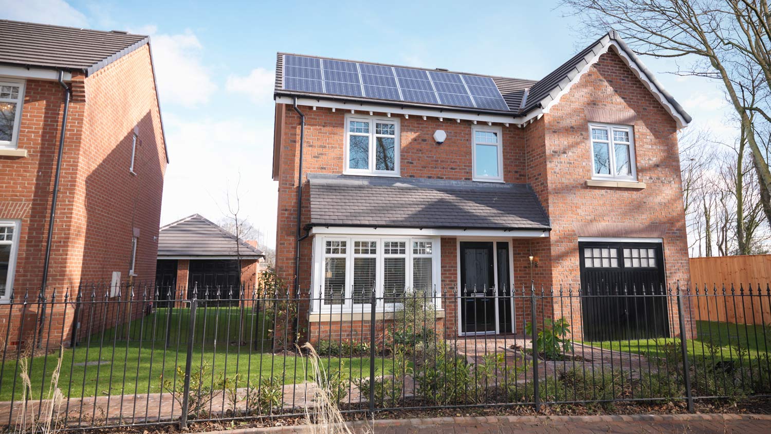 Energy efficient house with solar panels on roof