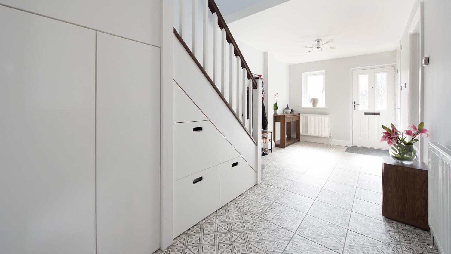 A bright hallway with tile flooring