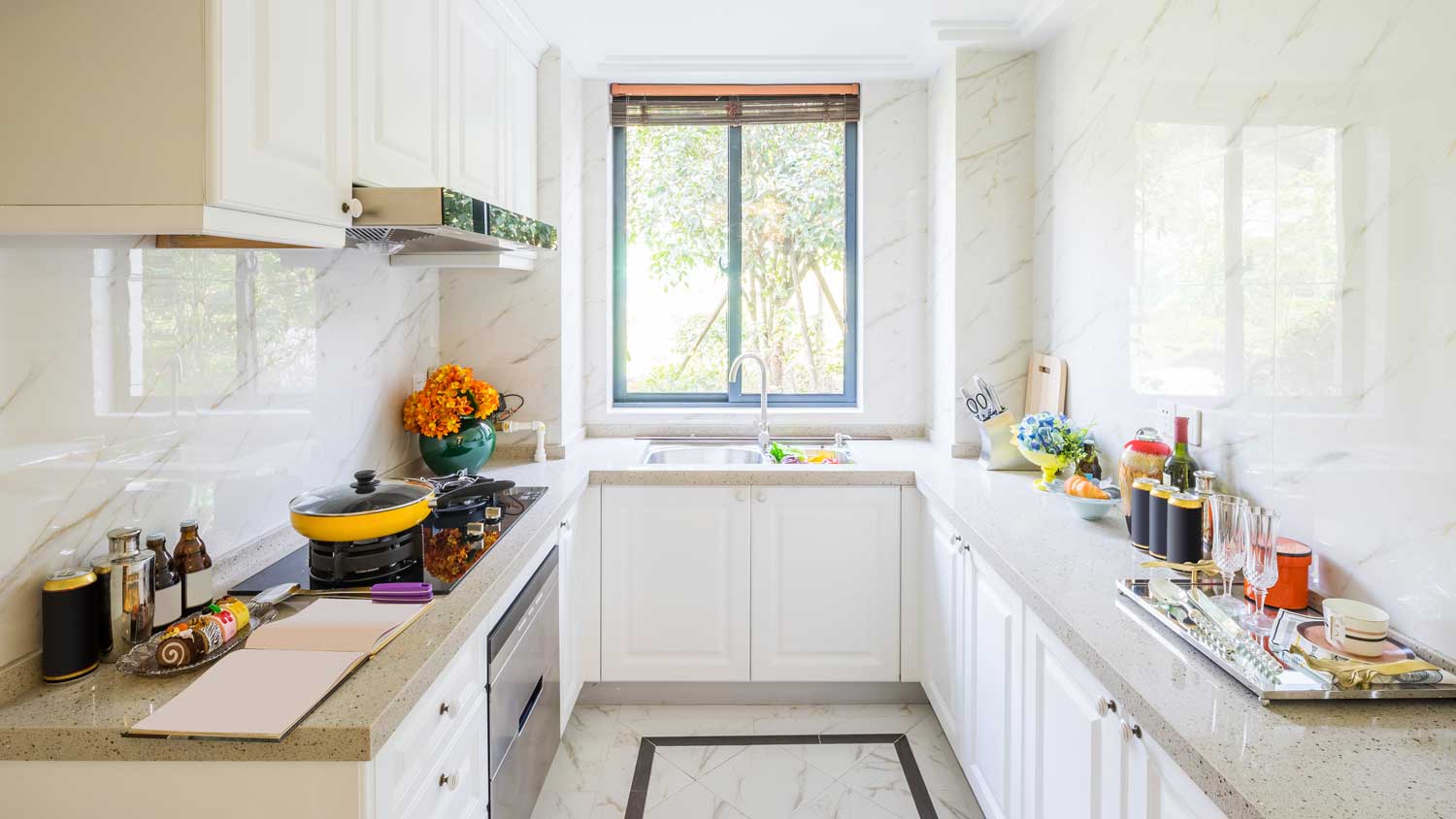 A bright kitchen with a garden window above the sink