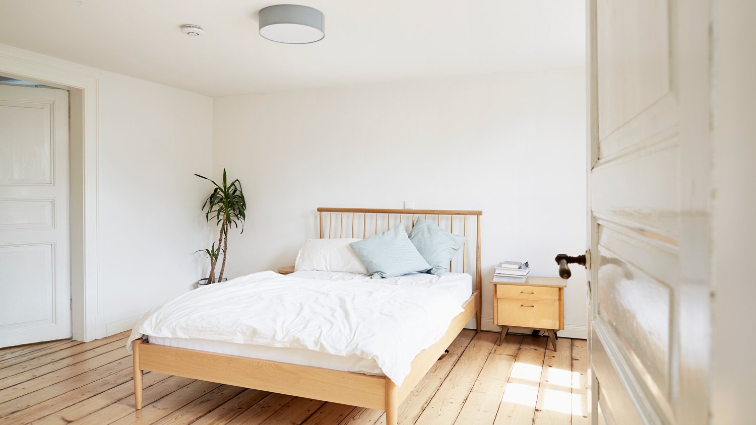 A bright modern bedroom in an old country house