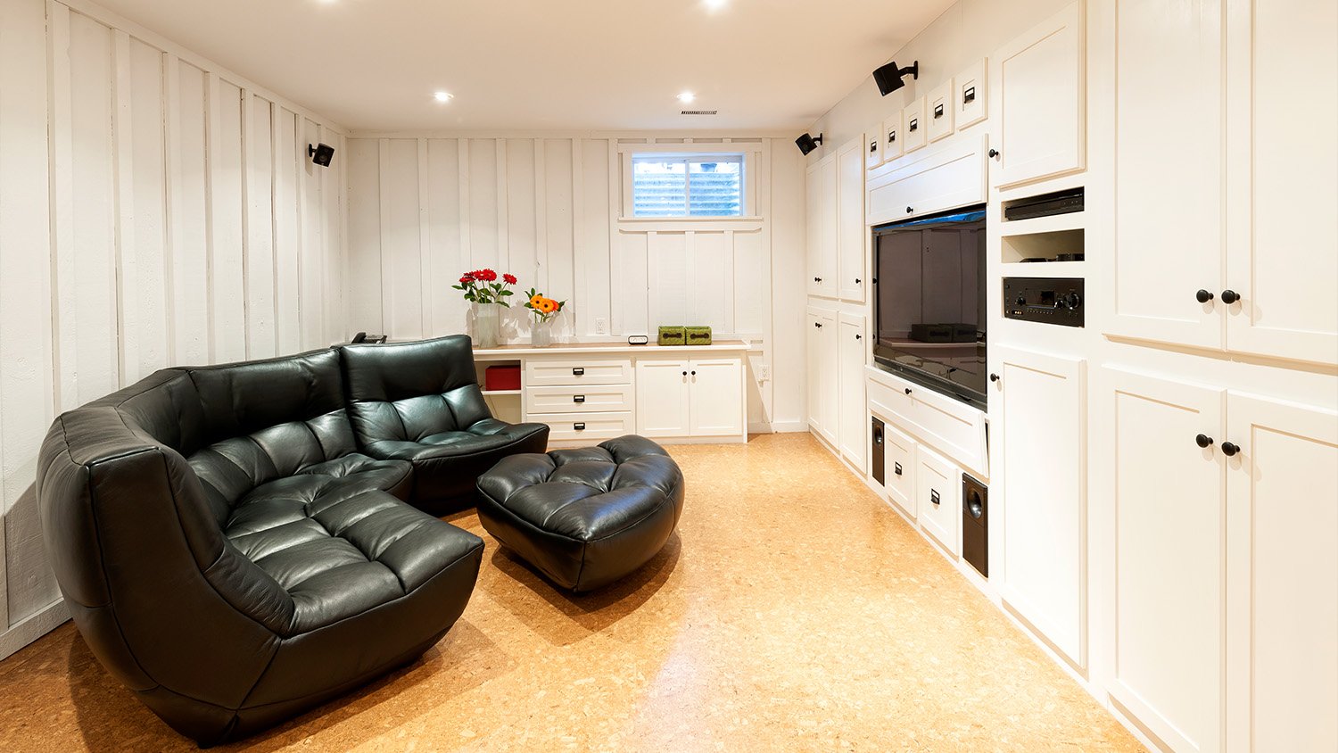 finished basement setup with TV and couch