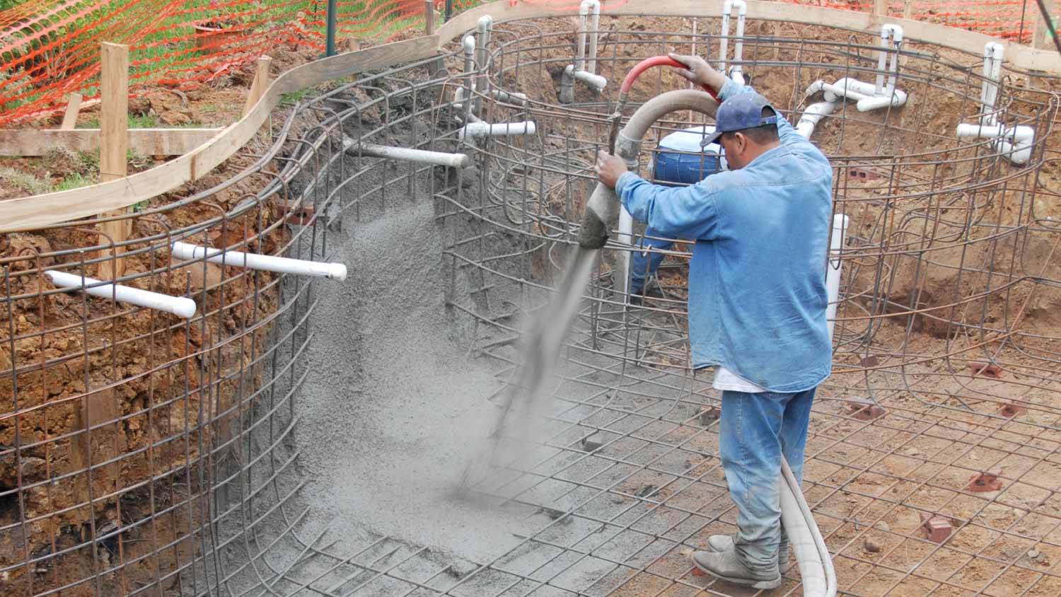 A builder spraying gunite
