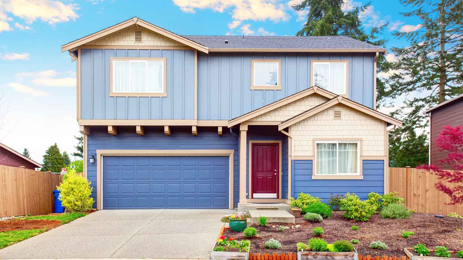 Blue siding house with built-in garage