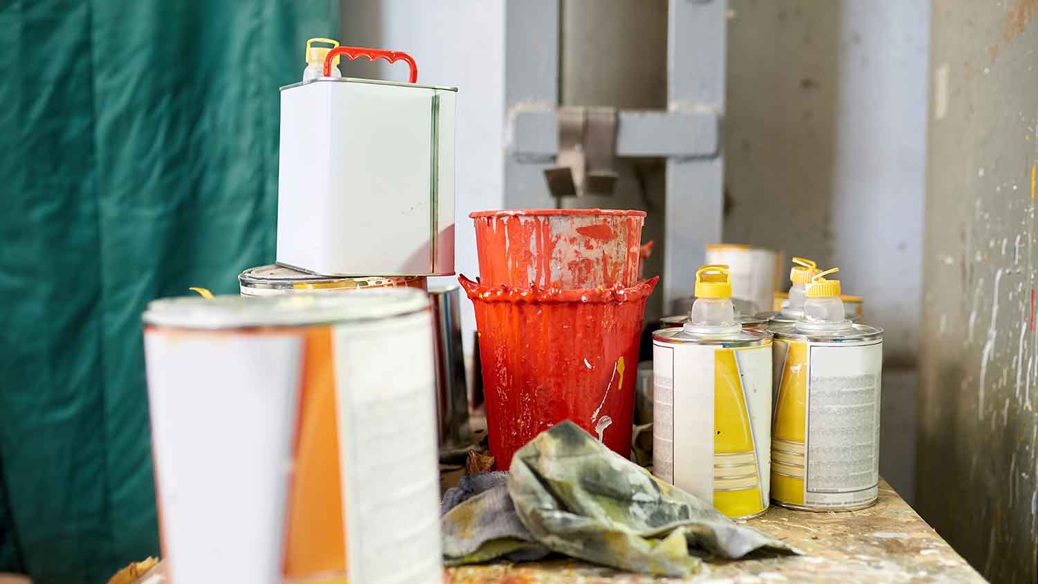 Cans of thinner and paint on a table