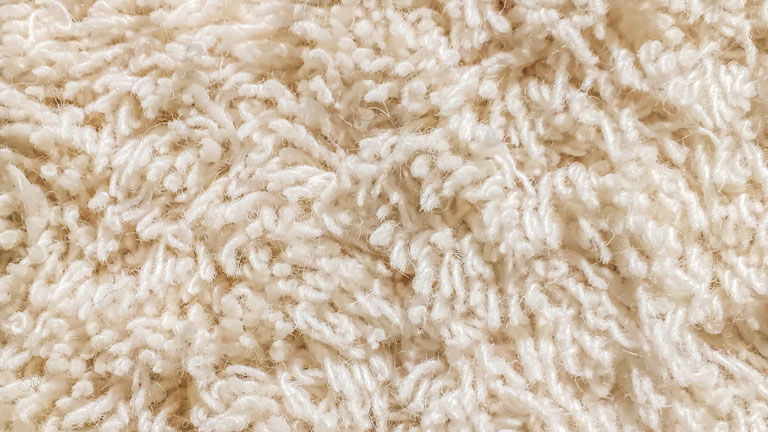 cream cut carpet pile closeup on texture