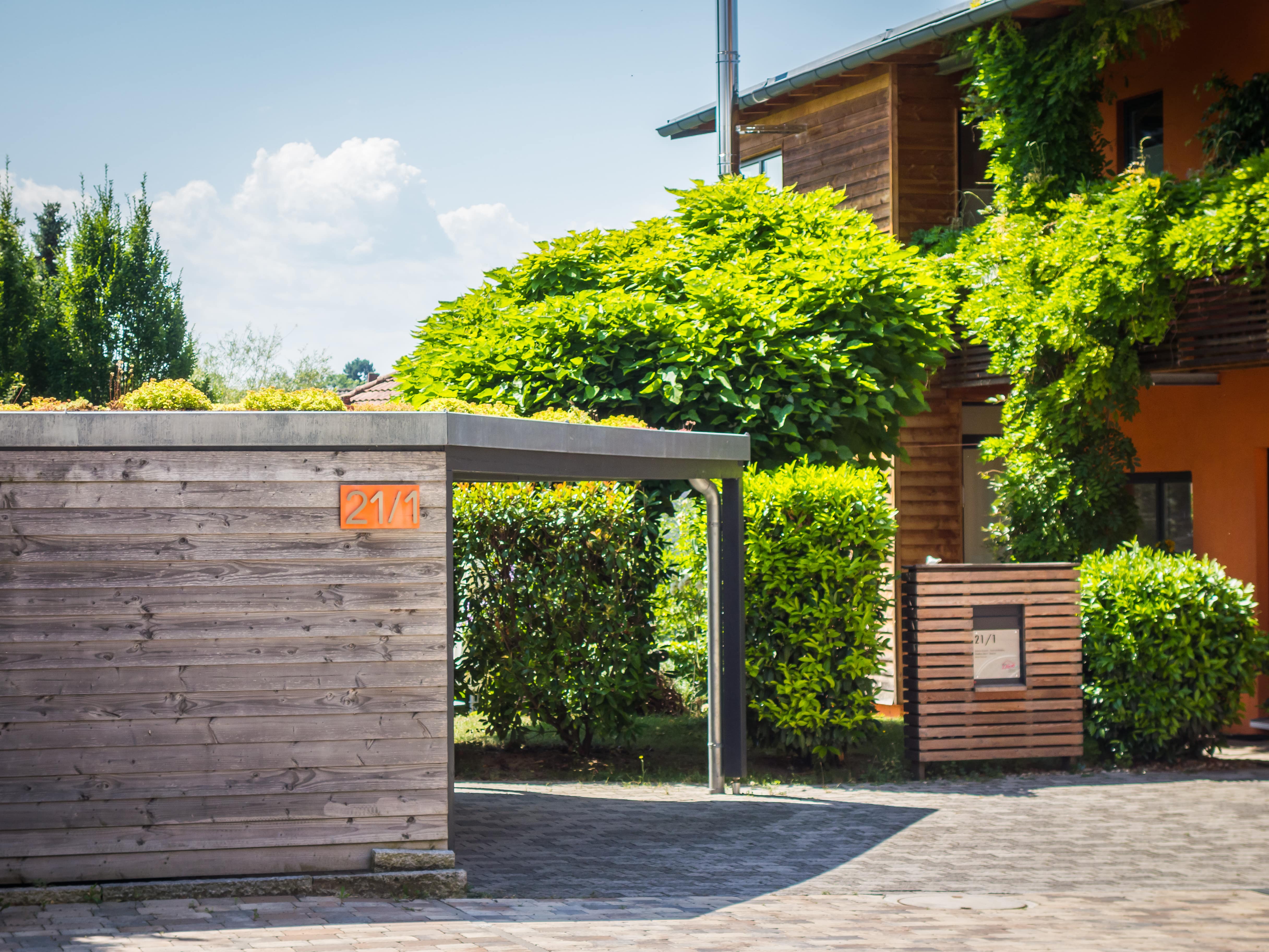 Separate freestanding carport outside of modern home