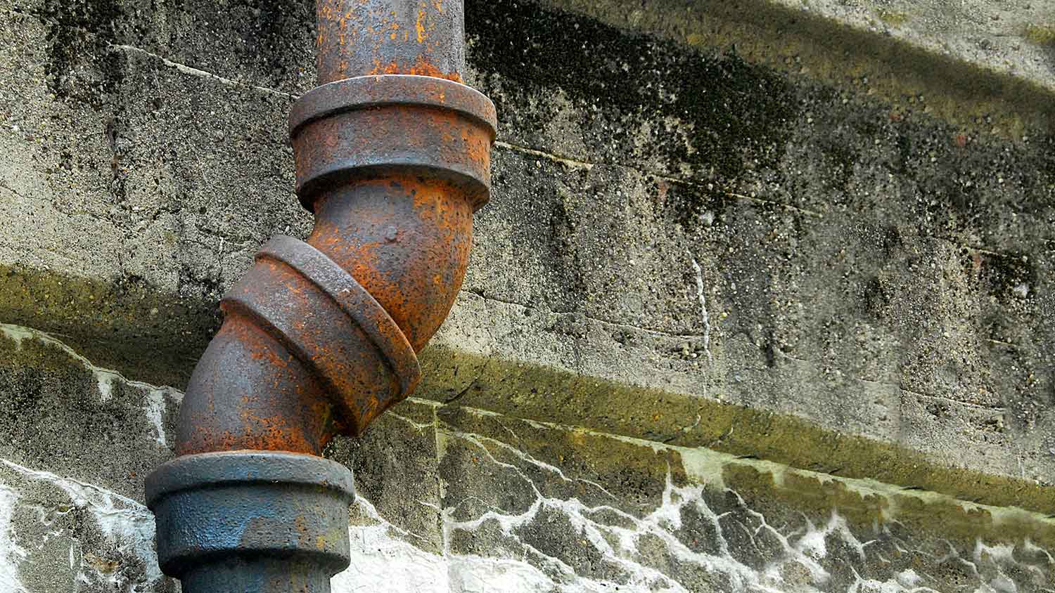 Cast iron sewer pipe outside of the building