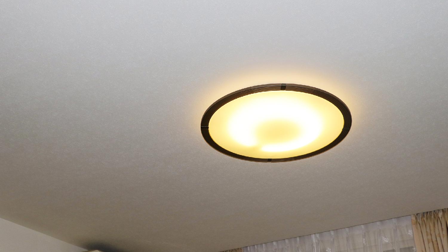 A ceiling light with a shade