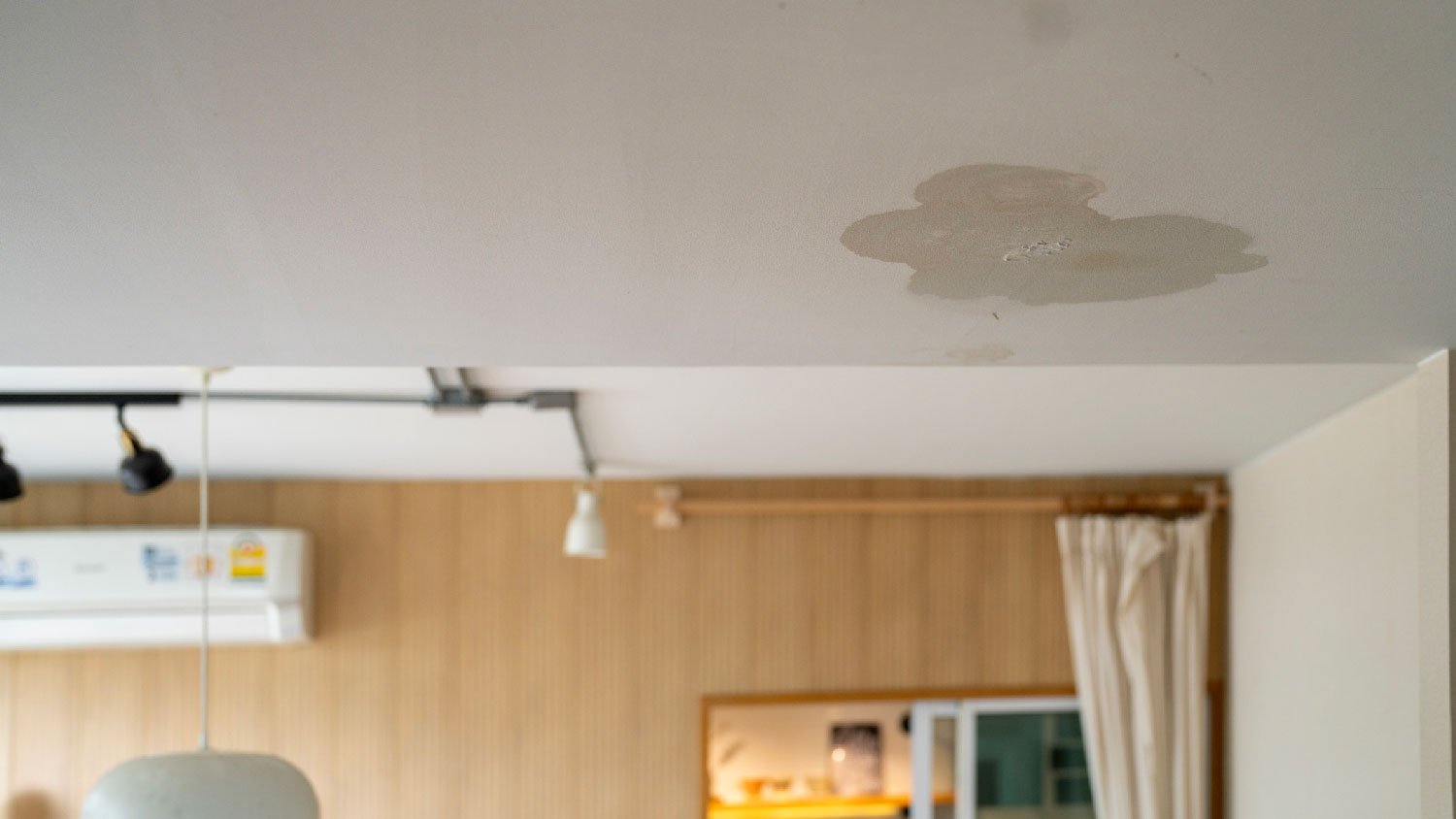 A painted ceiling showing traces of staining