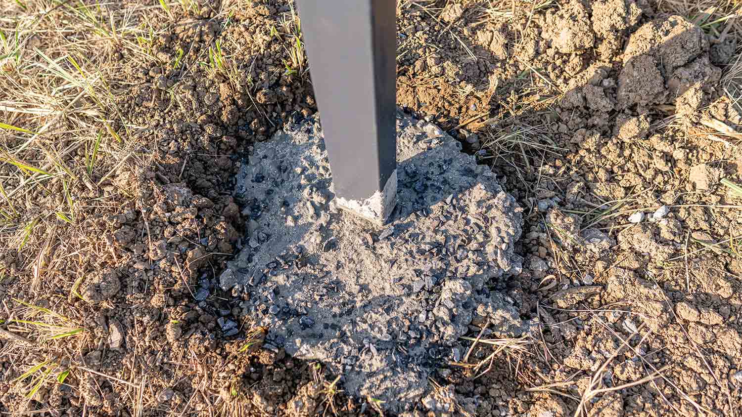 cement in ground for fence post