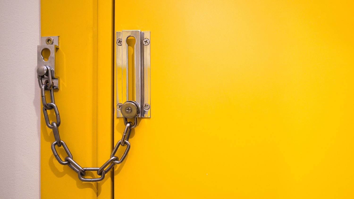 chain latch on yellow door