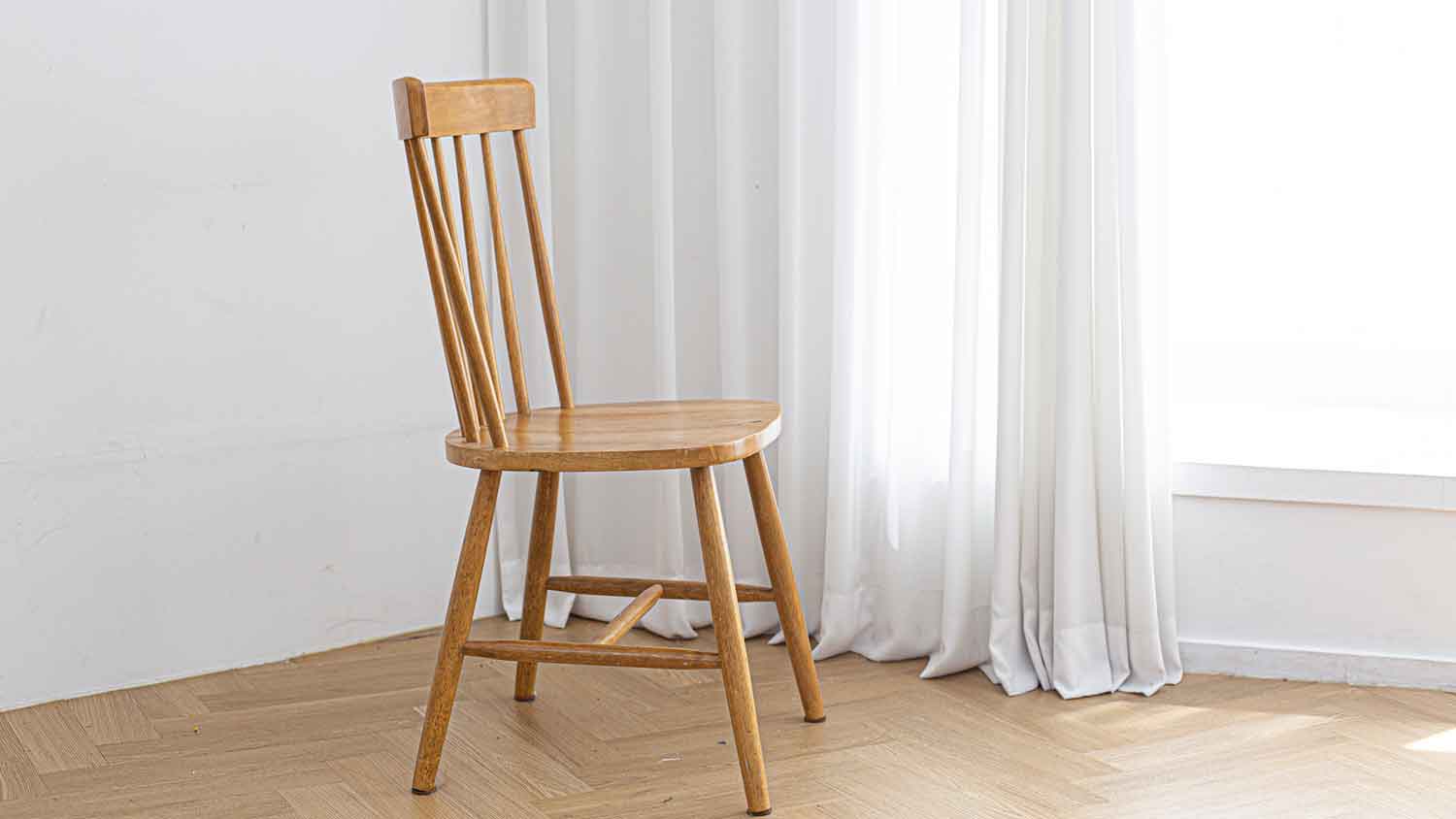 Wooden chair in the corner of the room