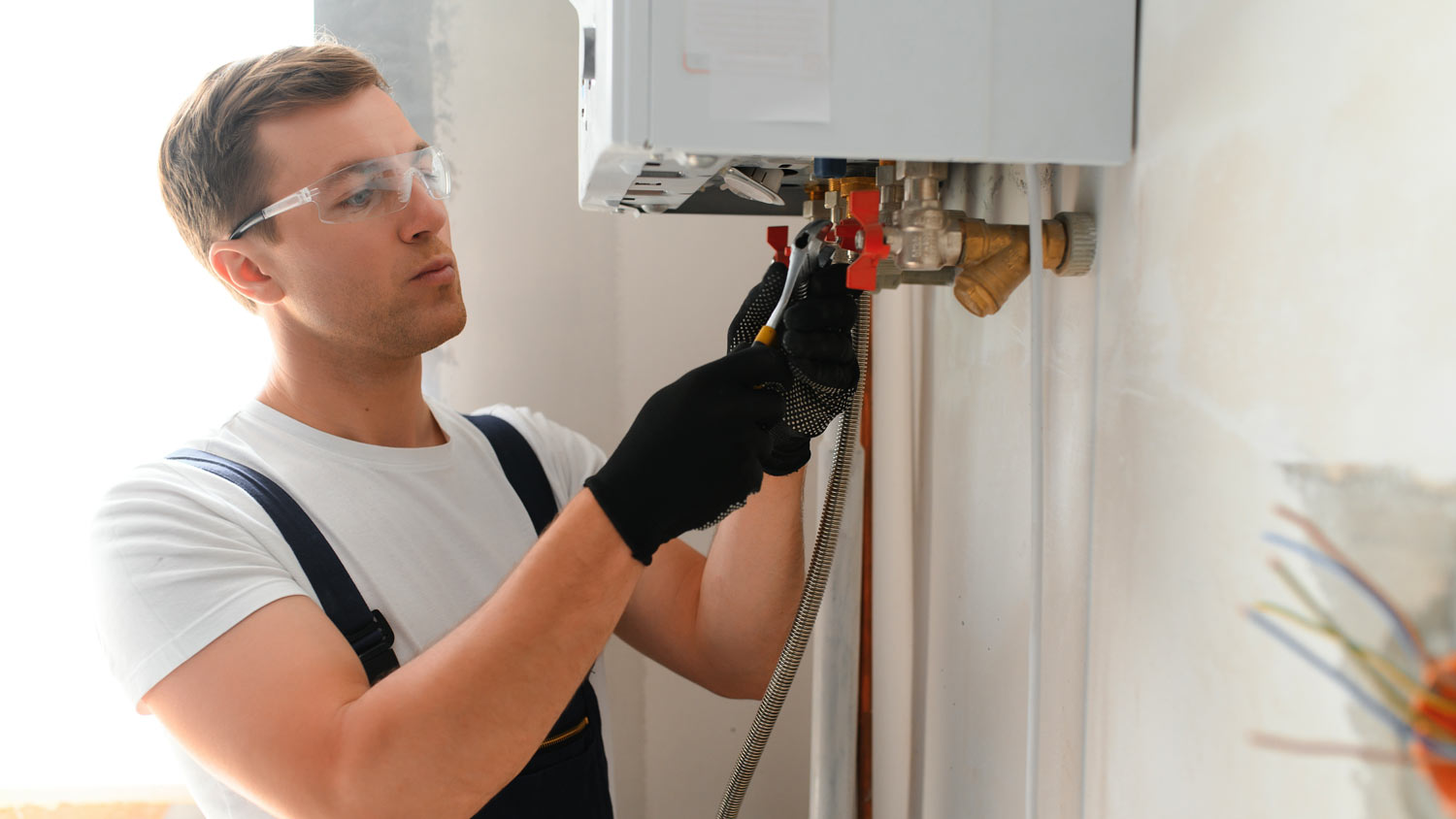 Professional checking boiler pipes
