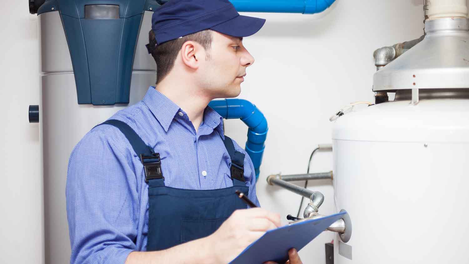 Technician inspecting water heater