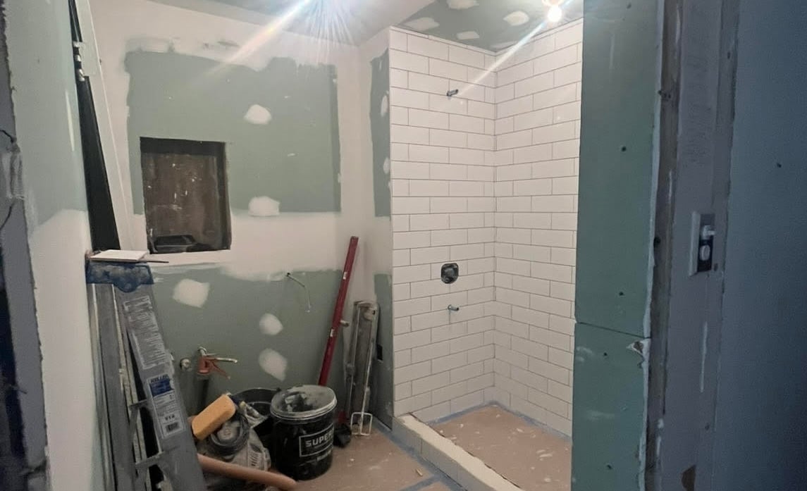 Remodel of an apartment bathroom with contractor tools
