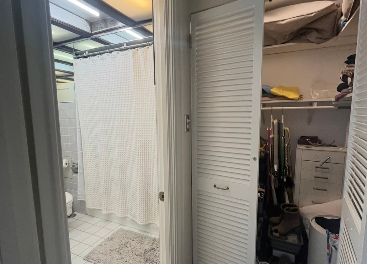 Linen closet outside of outdated bathroom