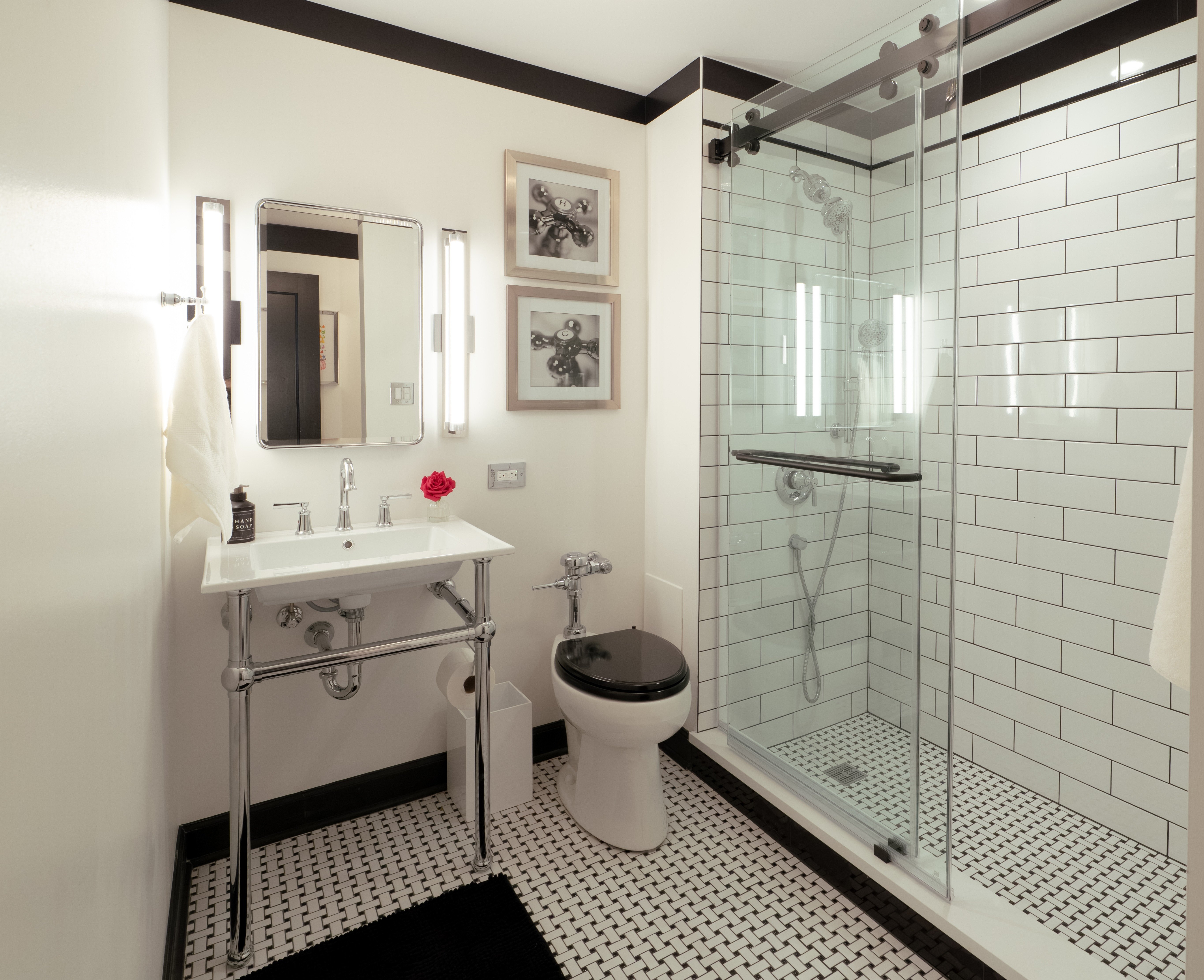 Vintage bathroom with basketweave tile floor and subway tile shower