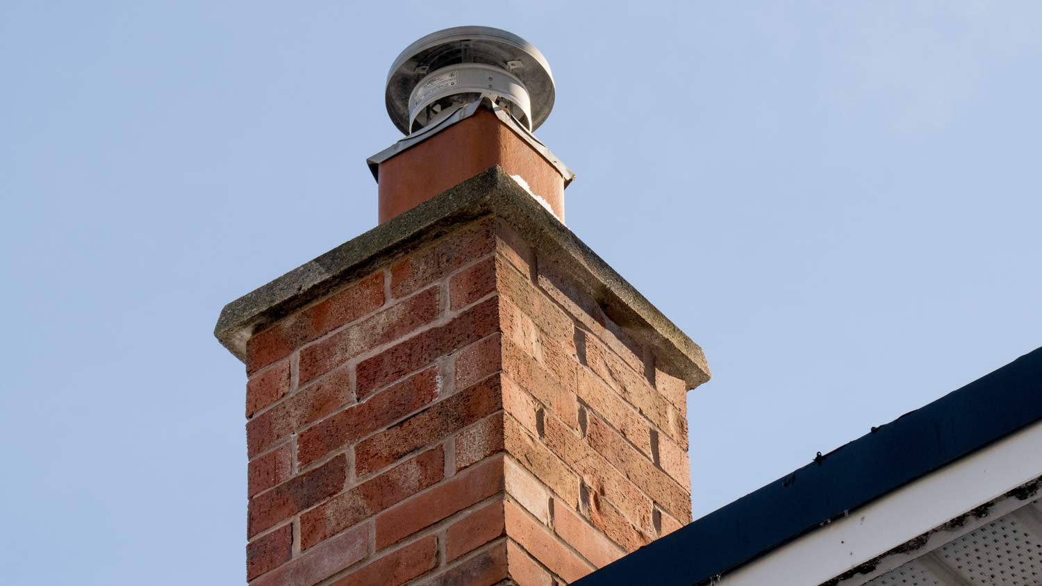 brick furnace chimney with flue liner and rain cap