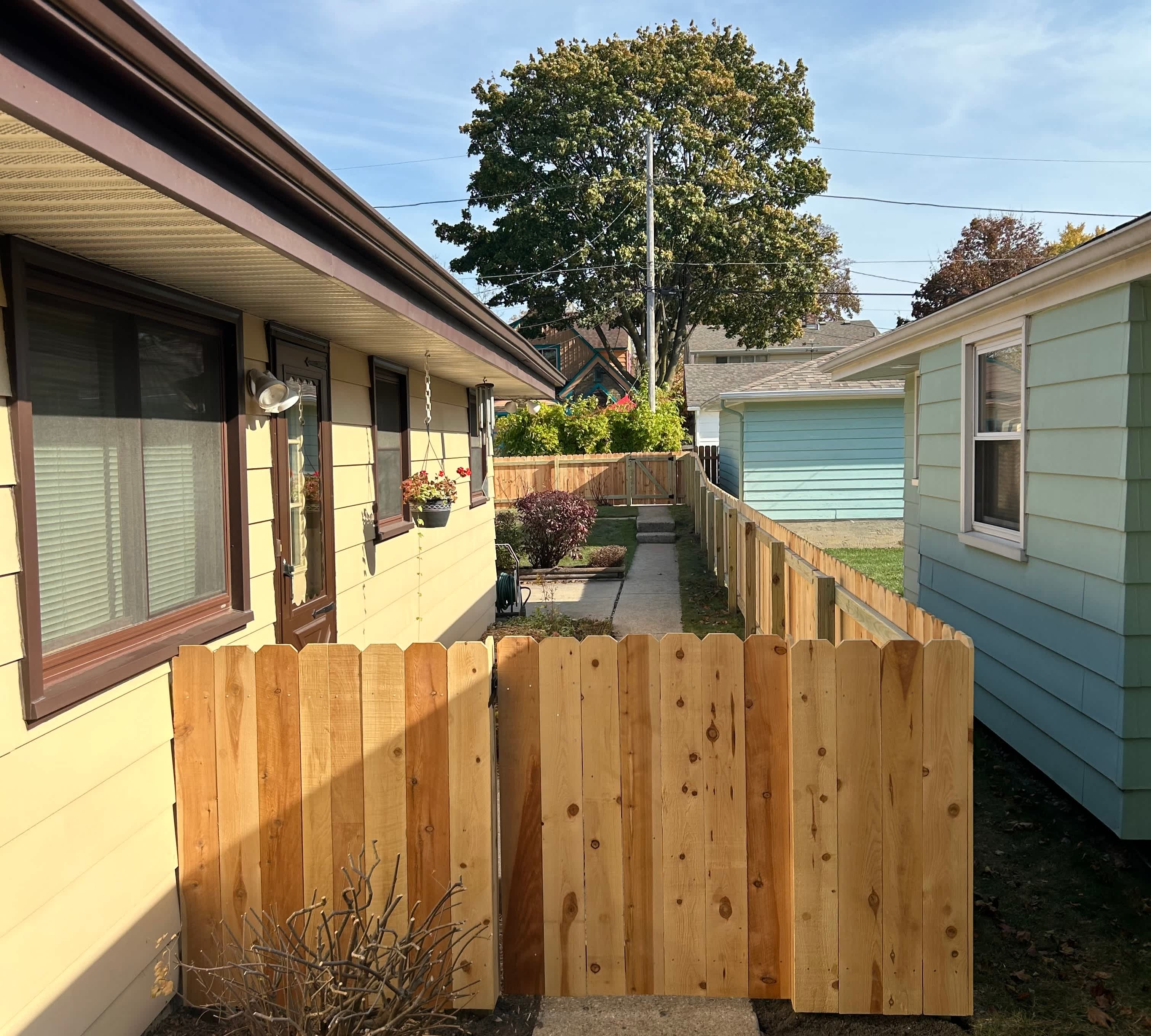 picket fence next to house