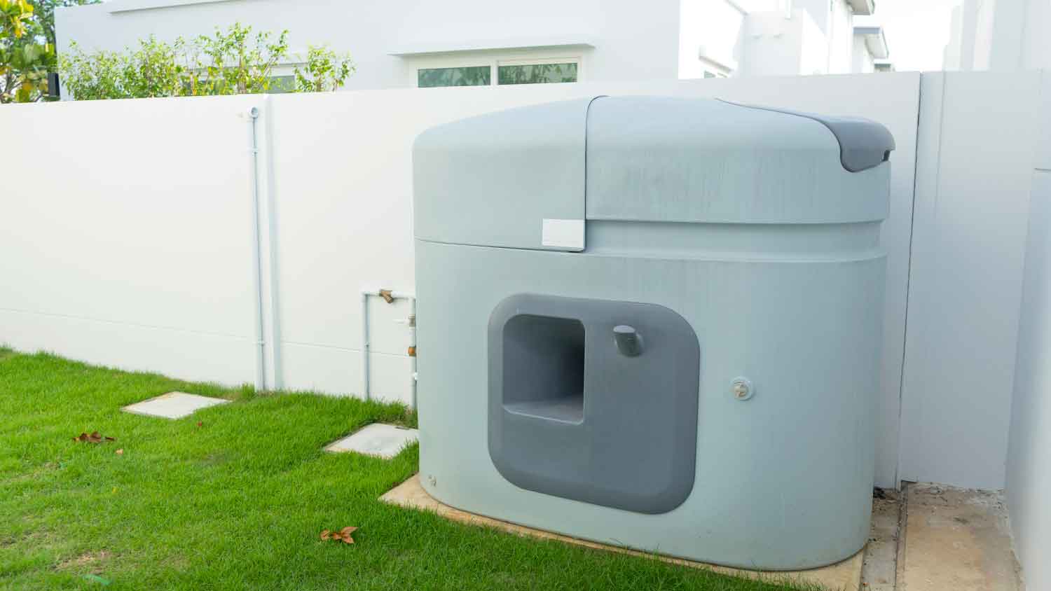 House with plastic cistern installed in the backyard 