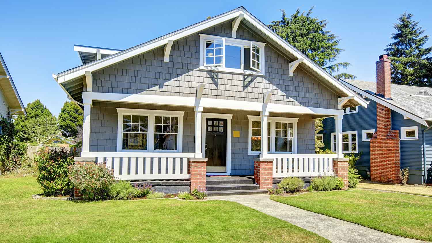 House exterior with clapboard siding and white window trim