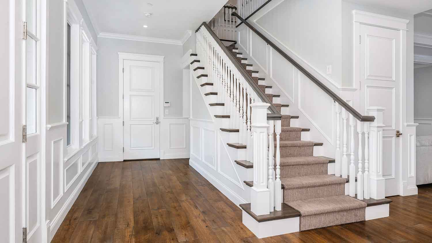 Wainscotting installed along the staircase