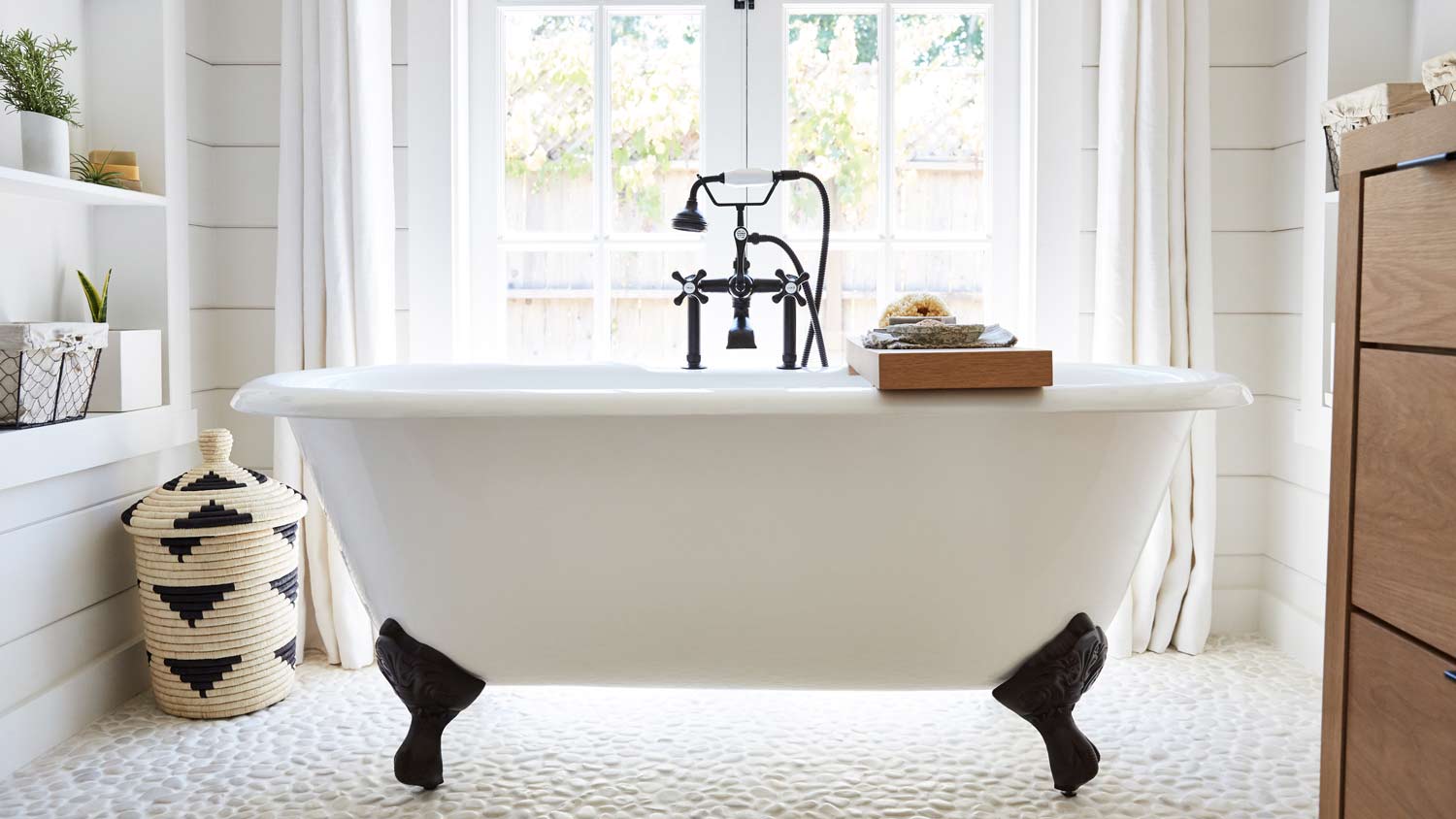 clawfoot tub in rustic farmhouse bathroom