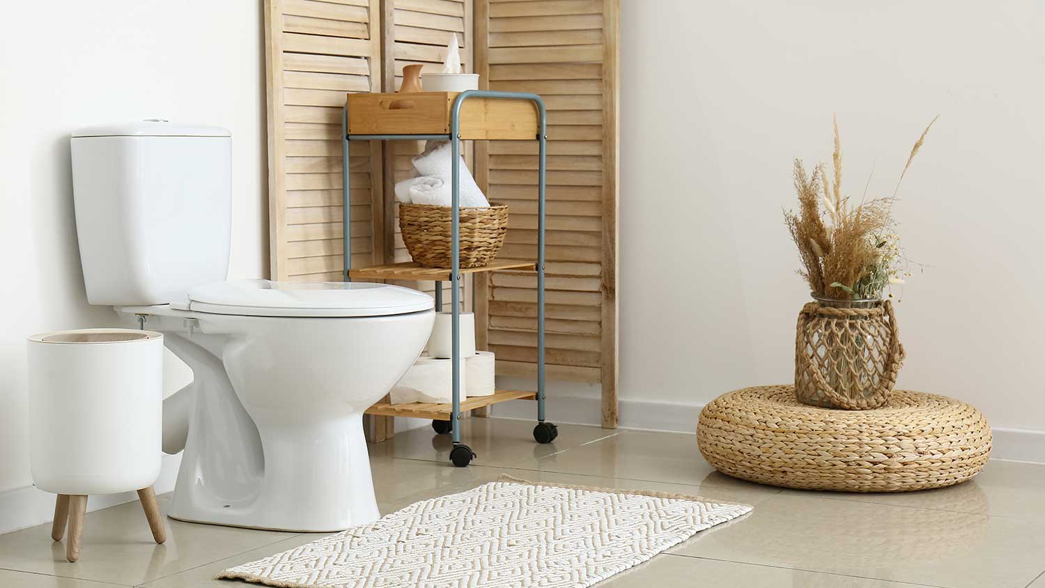 Clean and neat bathroom with a rolling cart