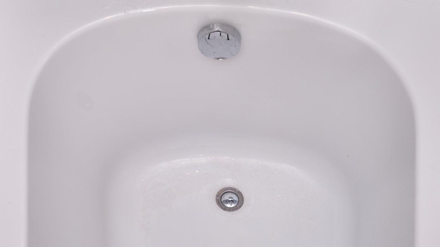 clean bathtub with drain