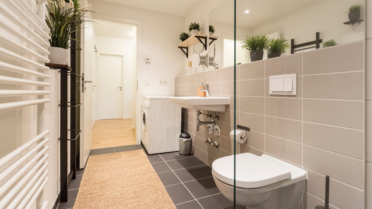 A clean modern bathroom with black tiles