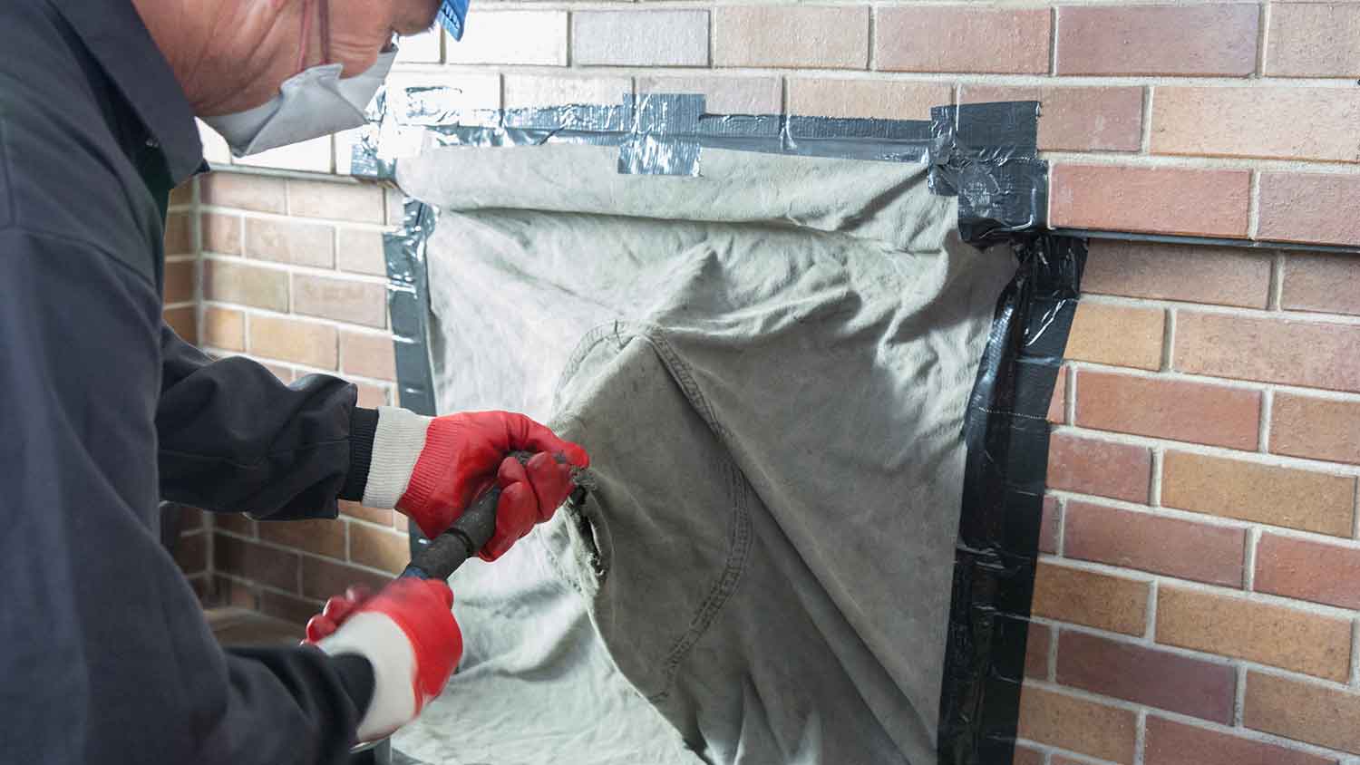 Drop cloth covering the opening of a fireplace