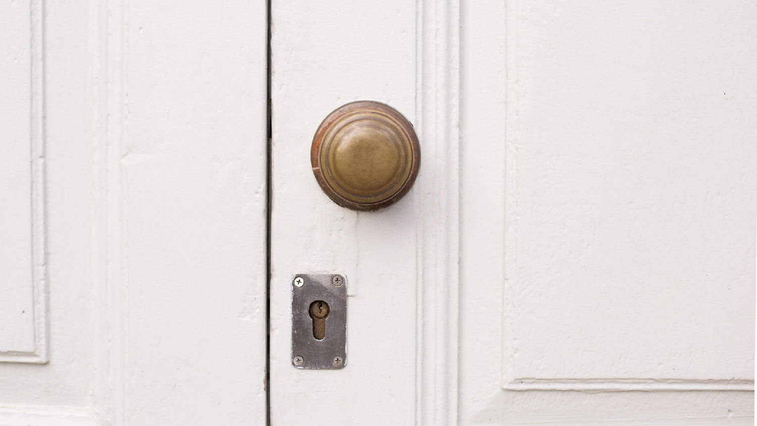 Close-up of a closed white door